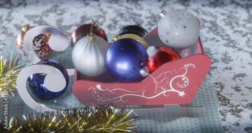 Festive toy sleighs and Christmas balls.
