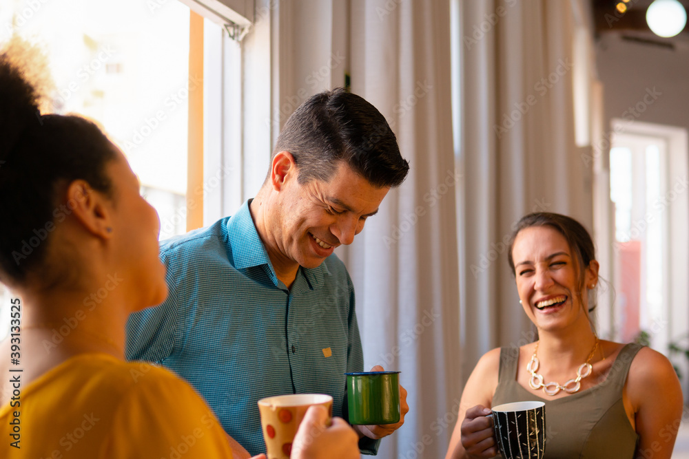 Joyful business woman talking causally with co-workers in the office. Conversation, communication, excited, interaction concept.. Joyful business woman talking causally with co-workers in the office. Conversation, communication, excited, interaction concept..