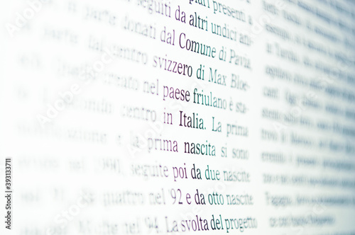 Newspaper font in Italian with background defocus