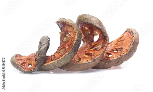 Dry bael fruit on white background photo