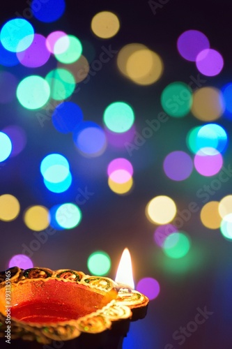 Colorful Diwali Indian traditional oil lamp with blurred lights