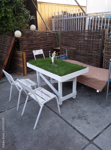 table with grass and chairs