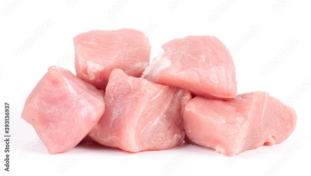 Pile of pork uncookes chopped cubes close up isolated on white background Pile of pork uncookes chopped cubes close up isolated on white background