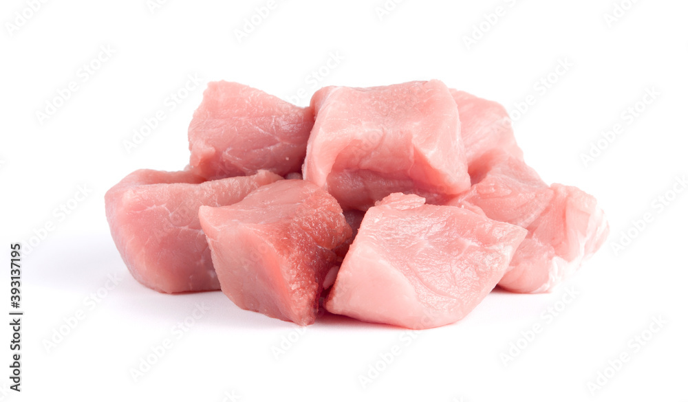 Pile of pork uncookes chopped cubes close up isolated on white background Pile of pork uncookes chopped cubes close up isolated on white background