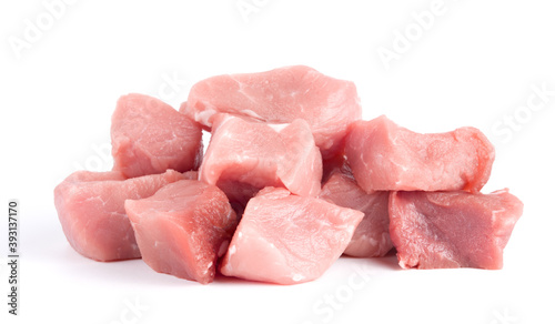Pile of pork uncookes chopped cubes close up isolated on white background
