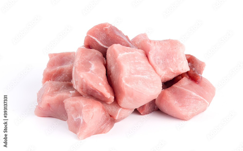 Pile of pork uncookes chopped cubes close up isolated on white background