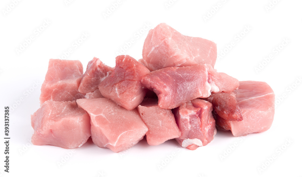 Pile of pork uncookes chopped cubes close up isolated on white background