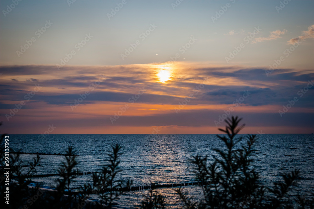 Sunset at the beach, Baltic Sea in Mecklenburg-Western Pomerania, Germany Sunset at the beach, Baltic Sea in Mecklenburg-Western Pomerania, Germany