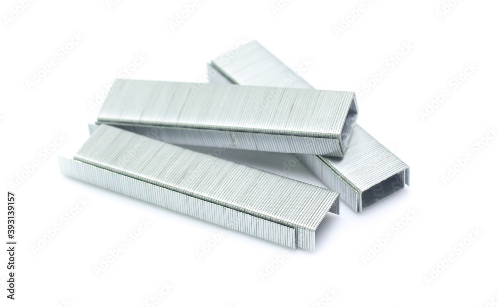 metal staple concept over white background