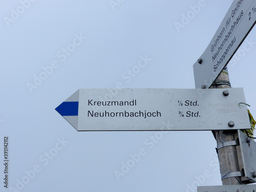 Signpost of Kreuzmandljoch hut in Allgau Alps, Bavaria, Germany photo