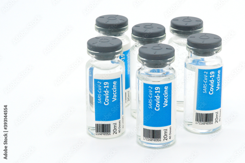 Six Covid-19 vaccination vials with white background Six Covid-19 vaccination vials with white background