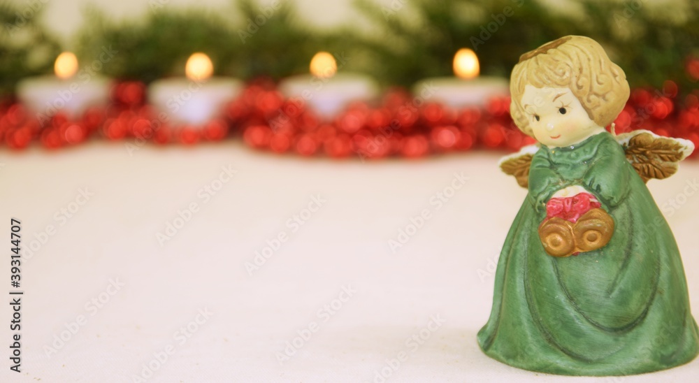Christmas angel green red candels background Christmas angel green red candels background