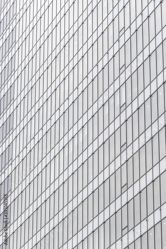Windows texture of an office building with repetitive shapes and great geometry, ready to use as a background