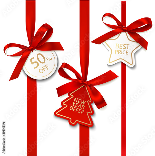 Set of decorative red bow with vertical ribbon and price tag isolated on white. New Year and Christmas decoration. Vector stock illustration.