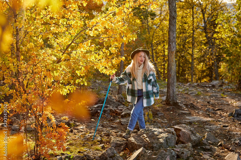 happy caucasian blonde woman is enjoying time in the forest, attractive female in casual wear, outdoor recreation happy caucasian blonde woman is enjoying time in the forest, attractive female in casual wear, outdoor recreation