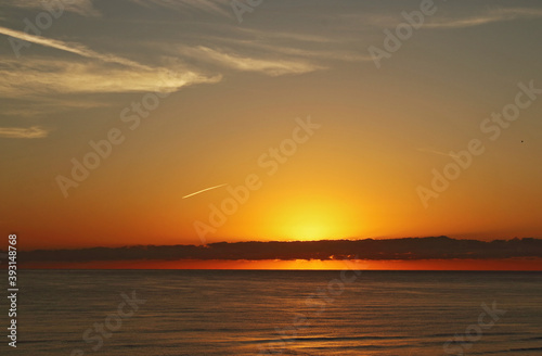 Yellow and red sunrise on the beach  sea landscape