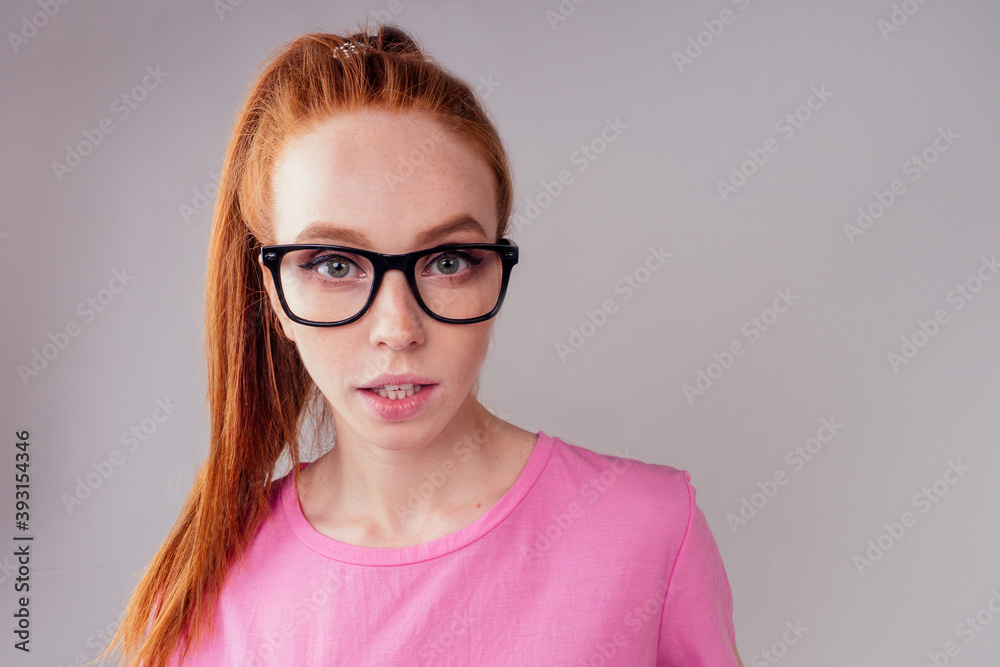 redhair ginger woman wearing glass in studio background fish eye