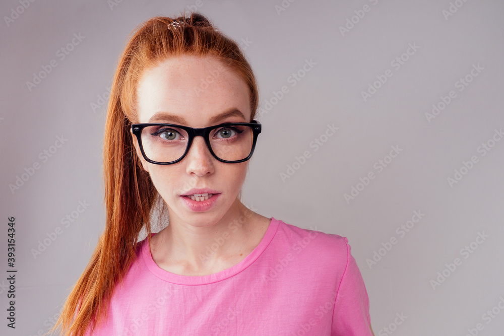Fototapeta premium redhair ginger woman wearing glass in studio background fish eye