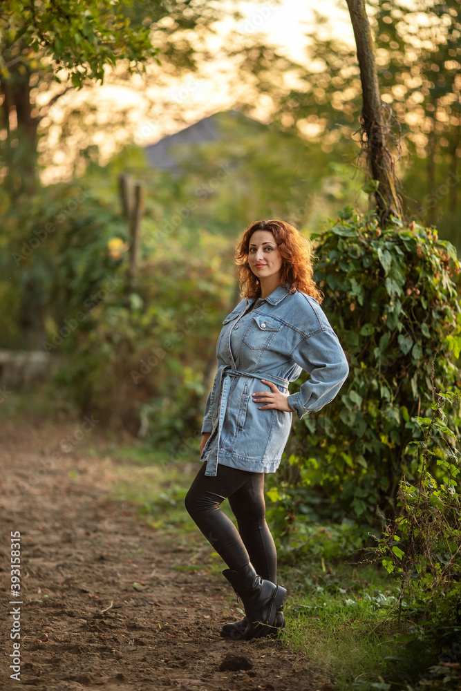 young beautiful girl in denim jacket on farm young beautiful girl in denim jacket on farm