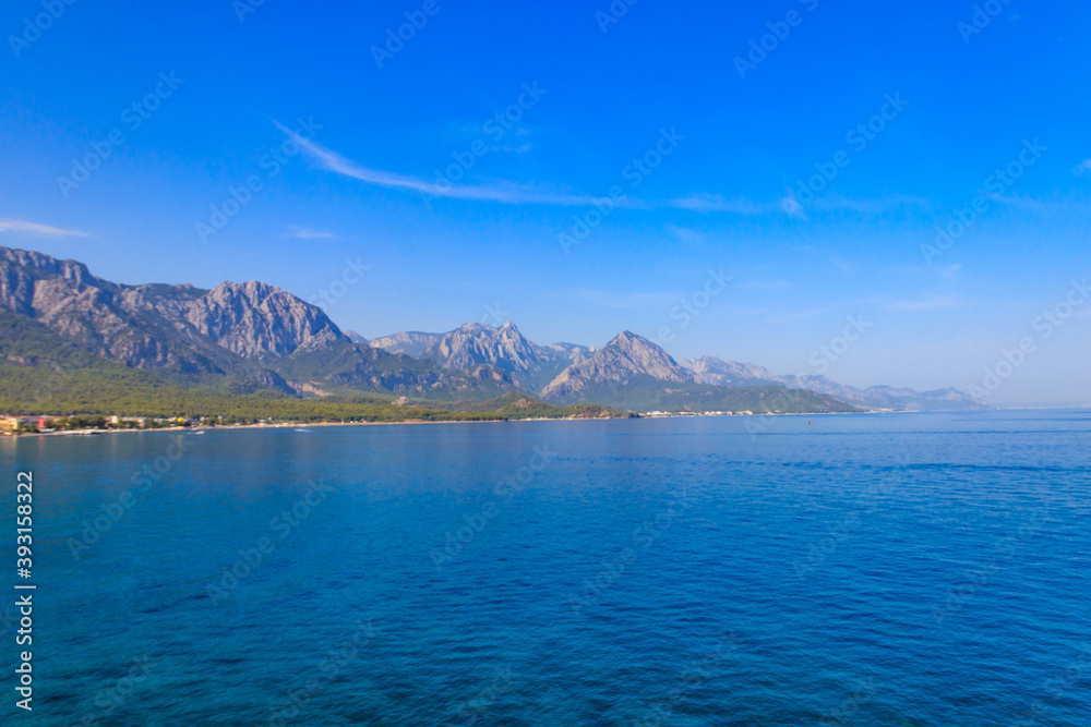View of the Mediterranean sea coast and the Taurus mountains in Kemer, Antalya province in Turkey