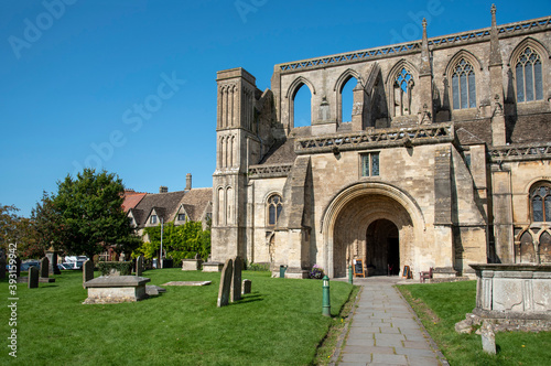 Malmesbury, Wiltshire, England, UK. 2020. The exterior of the 12th century Malmesbury Abbey and graveyard. photo