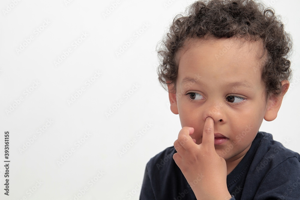 little boy picking his nose on white background stock photo little boy picking his nose on white background stock photo