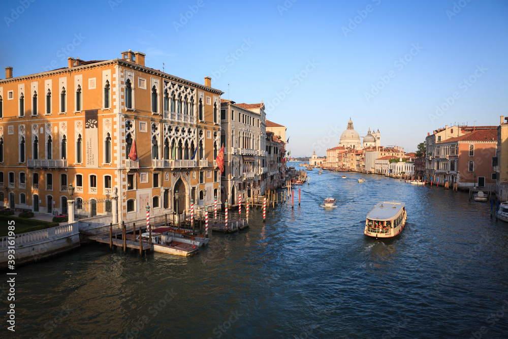 View of boats moving in Grand Canal amidst buildings
