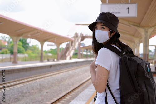 woman with a backpack with mask , after pandemic traveling