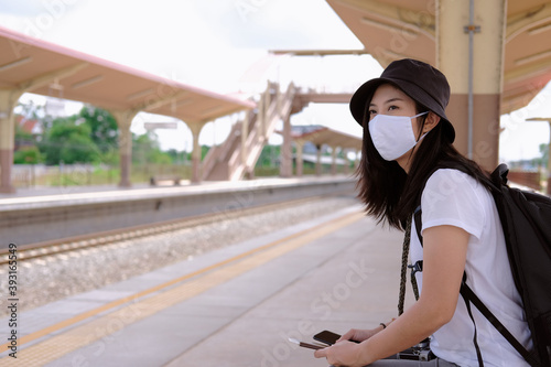 woman with a backpack with mask , after pandemic traveling