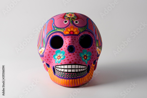 beautiful traditional mexican crafts, skull with colorful decorations for the day of the dead
