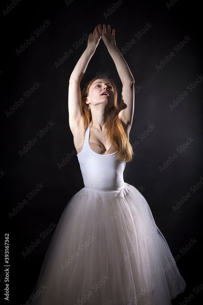 Young beautiful woman in a tutu studio portrait. Young beautiful woman in a tutu studio portrait.
