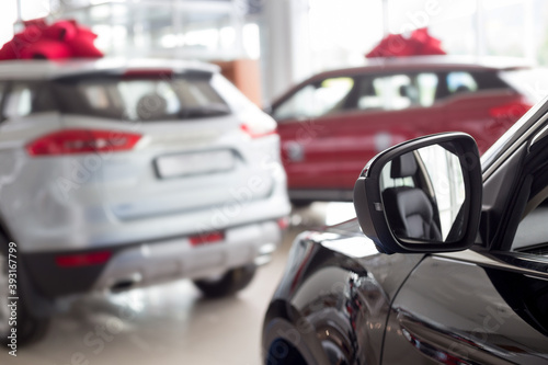 New modern cars with blur background. Car auto dealership. © tikhomirovsergey