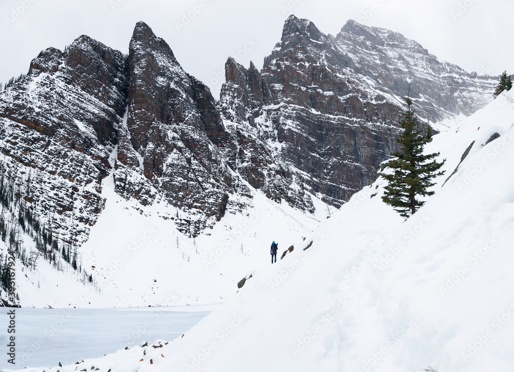An adventure girl hikes around Lake Agnes, Banff, Canada. 