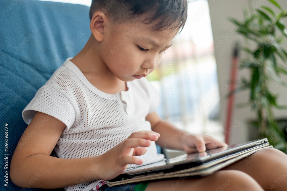 Little Asian Kid's using Digital Touchscreen Phone Tablet
Computer Playing Games. Little Asian Kid's using Digital Touchscreen Phone Tablet
Computer Playing Games.