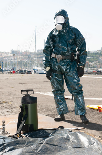man in protective suit against ebola, covid or pandemic virus photo
