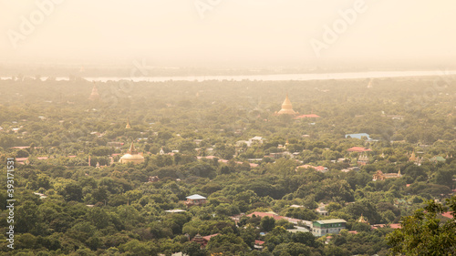 View from Umin Thounzeh Paya of Saigaing's cityscape with its pagodas photo