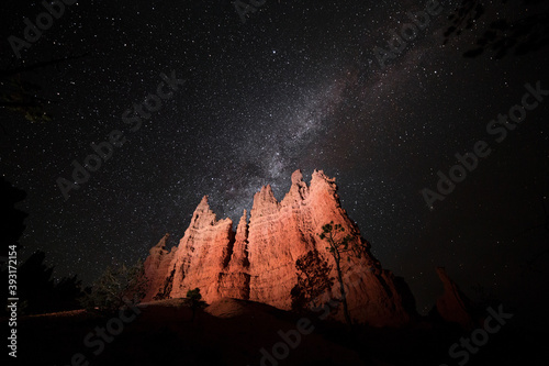 Milky way over hoodoos in Bryce Canyon National Park, UT, USA. Night hiking on a summer weekend road trip. 