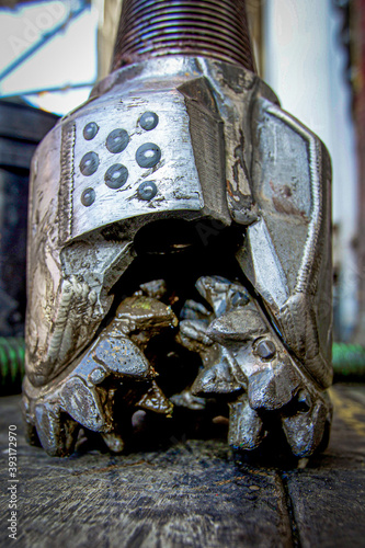 Drill bit sits on drill floor offshore photo