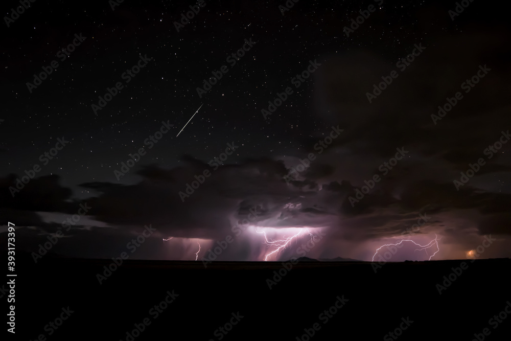 A lightning storm over the west desert in Utah with a dark night sky. 