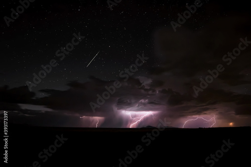 Fototapeta Naklejka Na Ścianę i Meble -  A lightning storm over the west desert in Utah with a dark night sky. 