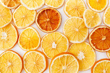 Christmas, winter, new year composition. Slices of dry oranges. Natural Citrus fruits pattern. Food background. Flat lay, top view