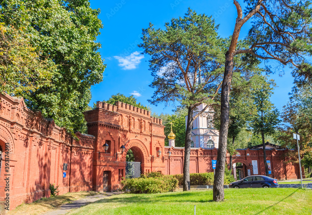 Huge old brick gates of the Pokrovskoe-Streshnevo Estate on a Sunny summer day. Moscow. Russia