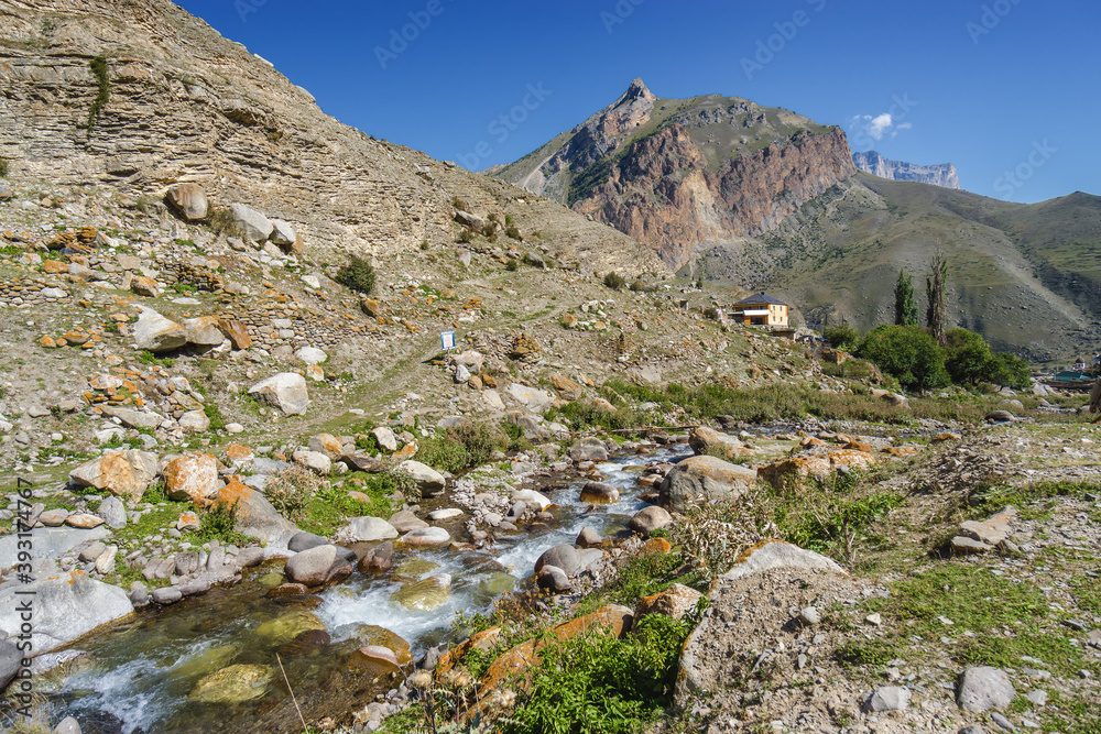 Sunny view of  mountains and Eltyulbyu village in North Caucasus, Kabardino-Balkaria, Russia.