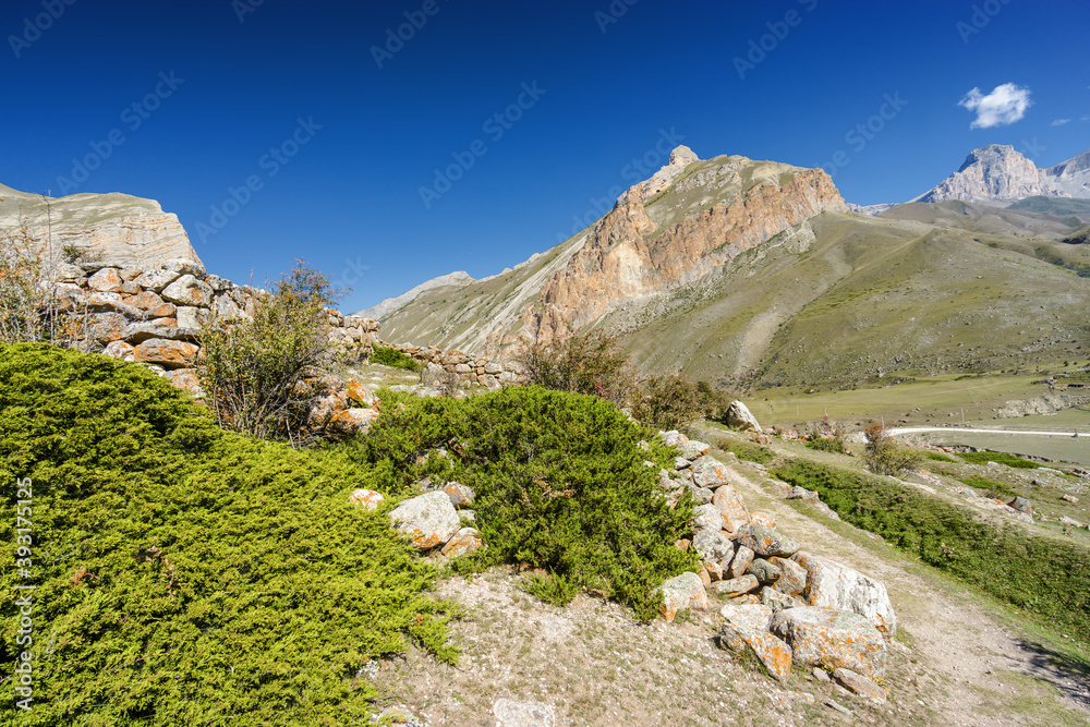 Sunny view of  mountains and Eltyulbyu village in North Caucasus, Kabardino-Balkaria, Russia.