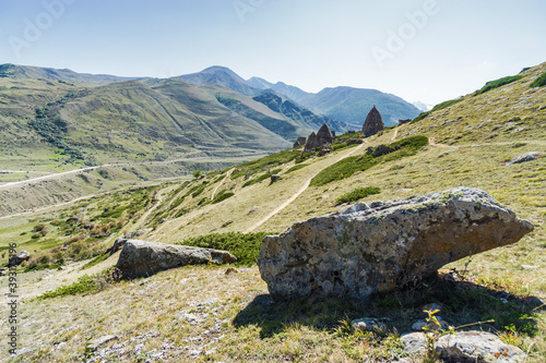 Sunny view of mountains and Eltyulbyu village in North Caucasus, Kabardino-Balkaria, Russia.