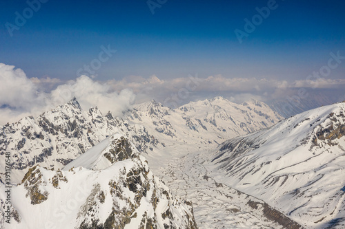 Remote snow covered alpine mountain landscape in the Nepal Himalaya photo