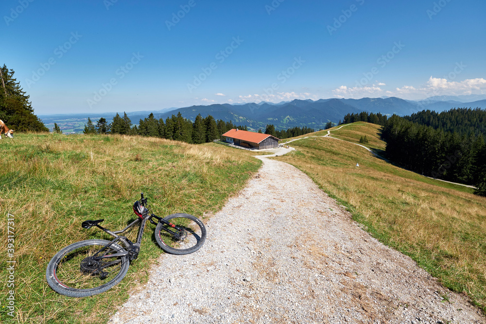 Fototapeta premium Mountain landscape with mountain bike in the foreground