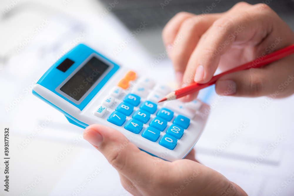 man hand use calculator with financial spreadsheet data man hand use calculator with financial spreadsheet data