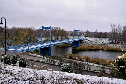 pedestrian bridge over the river in winter