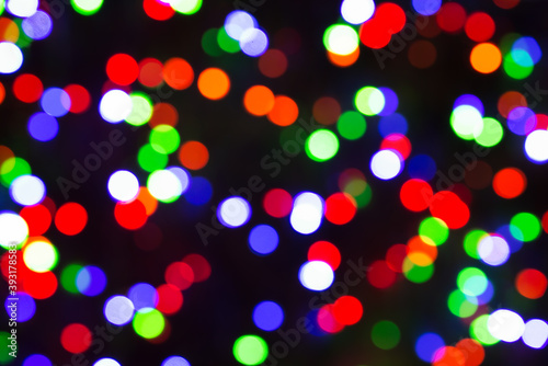 Festive Christmas lights background. Blurred pattern - bokeh with light.